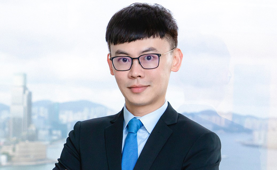 Hong Kong ADR specialist in a business suit.