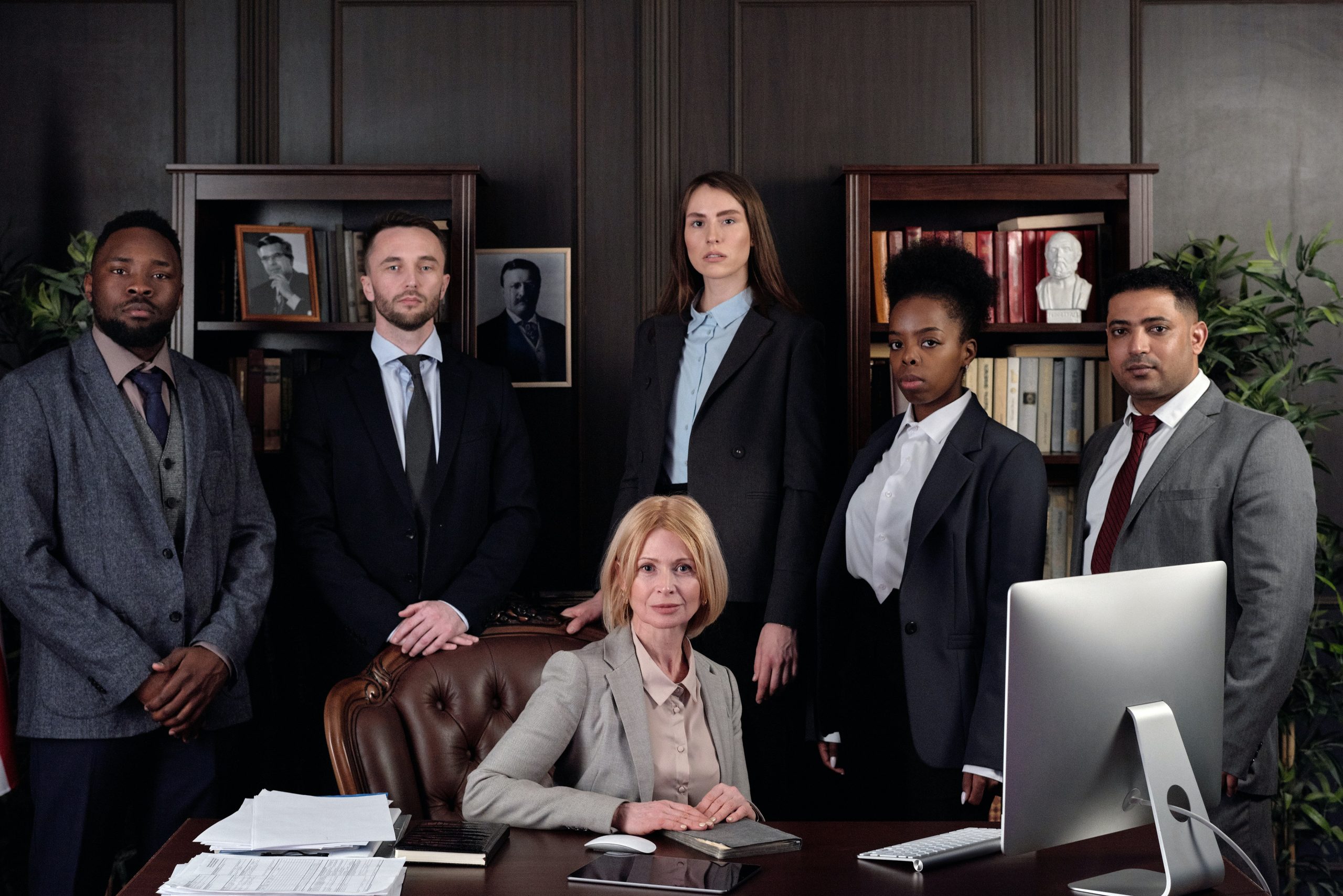 A group of lawyers pose for a photo