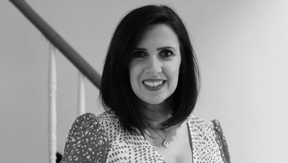 Female legal professional standing in front of bannister