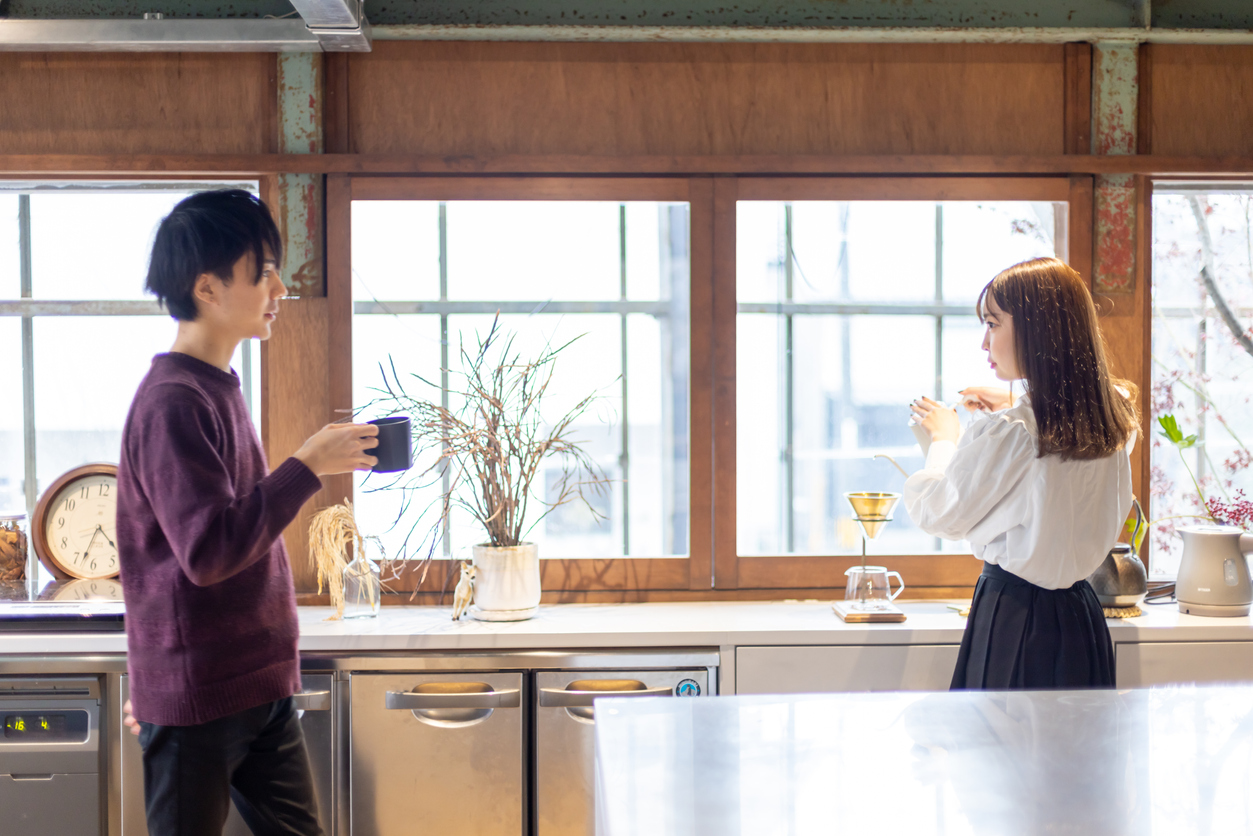 Cohabiting couple talking in the kitchen