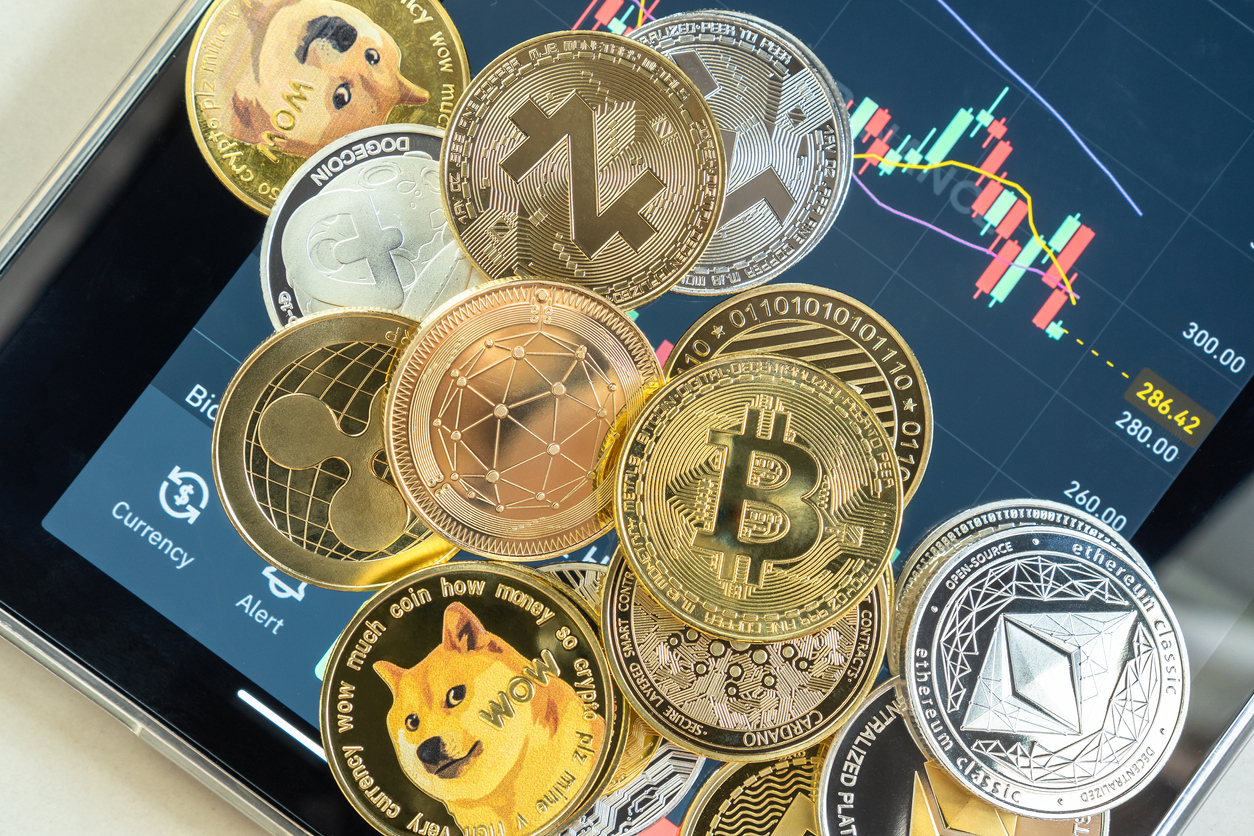 Cryptocurrency coins displayed on smartphone trading app