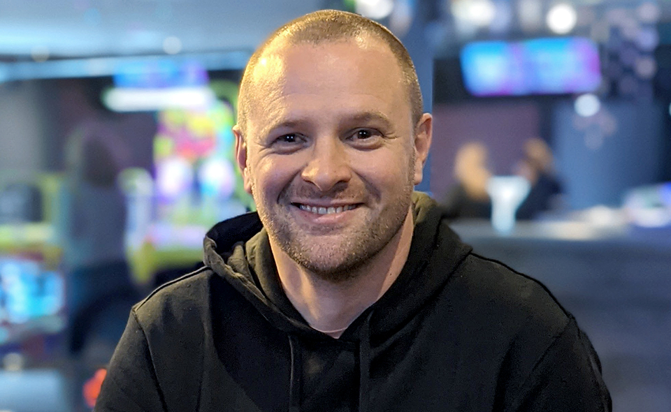 Legal recruitment specialist Alex Dick standing in an office.