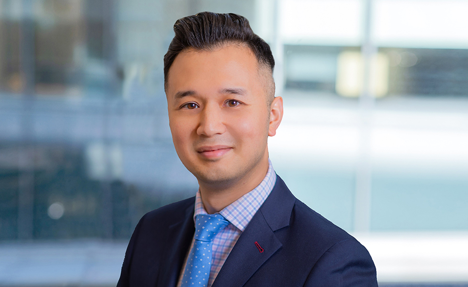 IPO specialist Jason Ye in a formal suit.