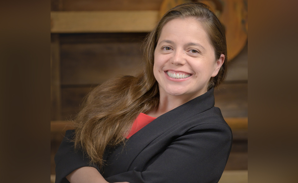 Business formation specialist Jessica Zubiate-Beauchamp standing indoors.