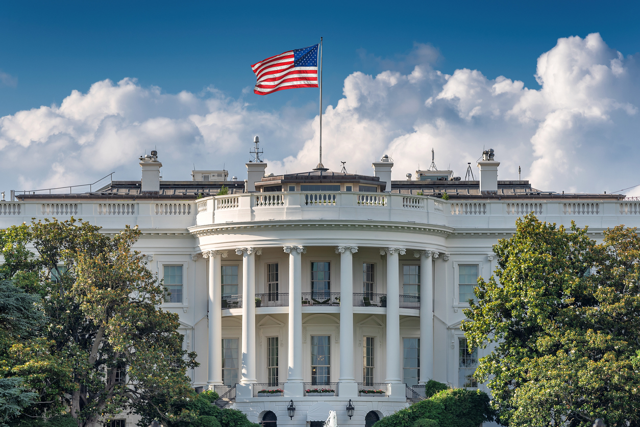 View of the White House from the lawn on a sunny day.