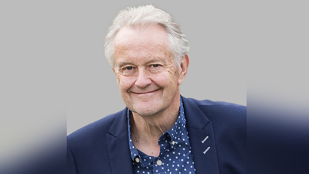 ADR specialist Stephen Townley standing before a grey background.