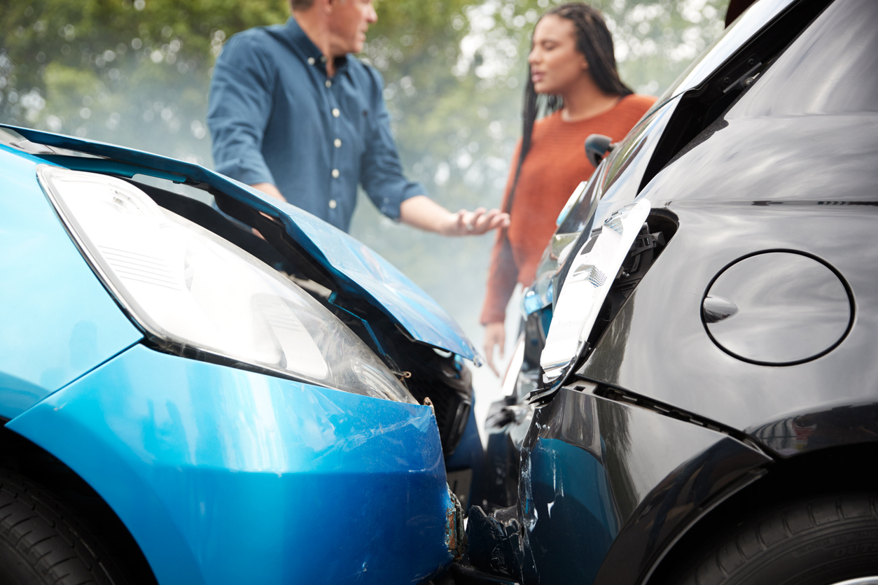 Two Angry Motorists Arguing Over Responsibility For Car Accident