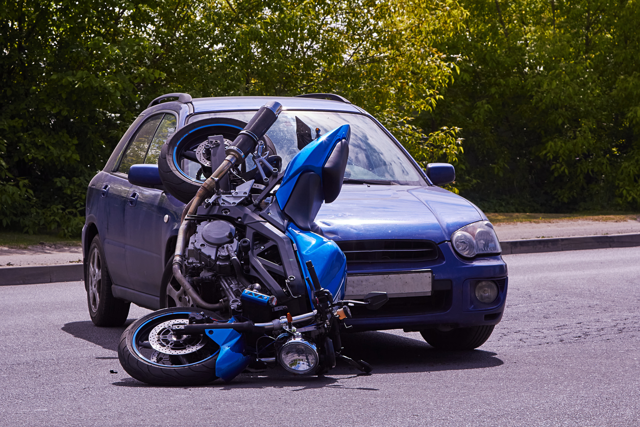 June 4, 2020, Riga, Latvia, damaged car and motorbike on the city road at the scene of an accident