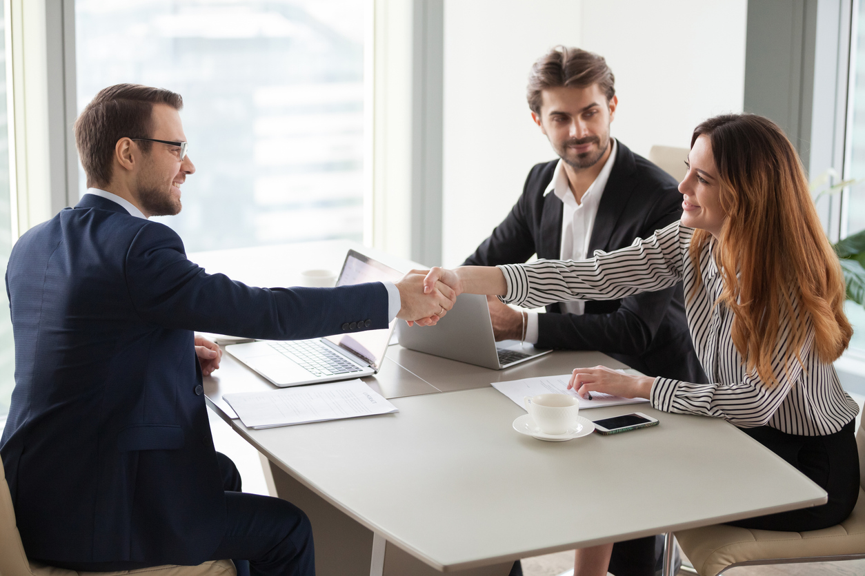 businessman handshaking businesswoman making deal finishing group negotiations