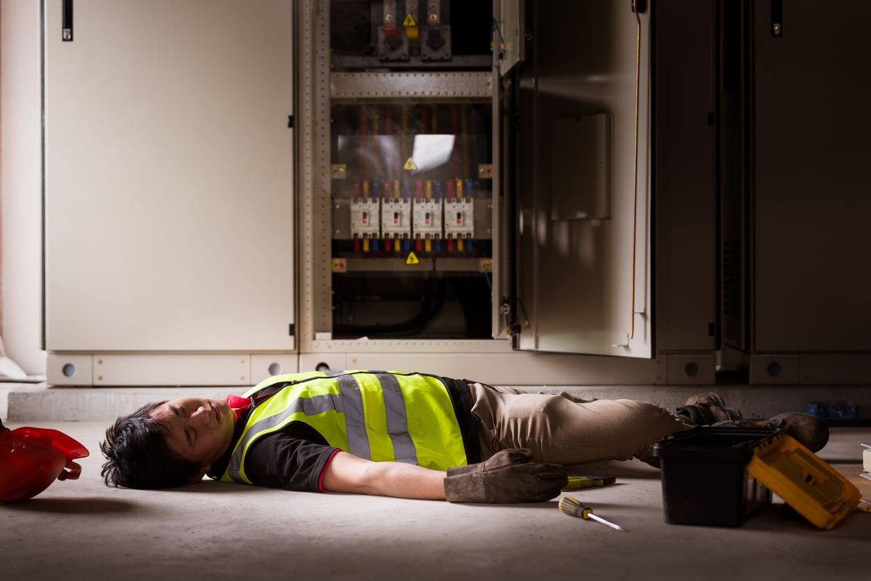 accident at work of electrician people or maintenance worker in the control room of factory.