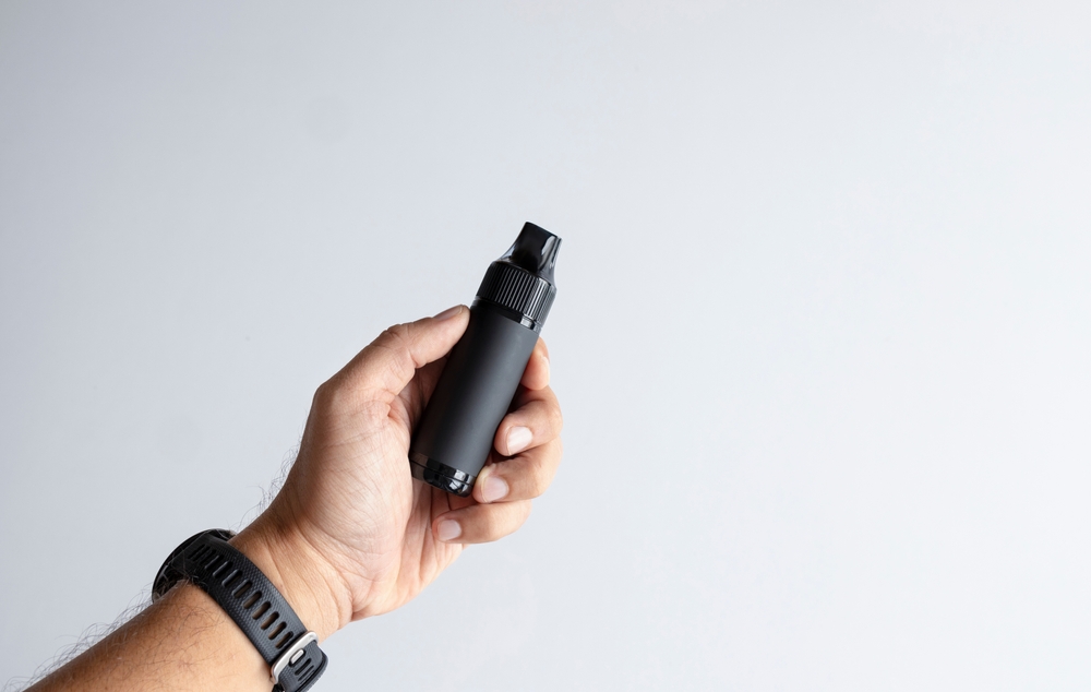 hand,holding,black,vape,device.,pod,kits,,pod,mods,,pod