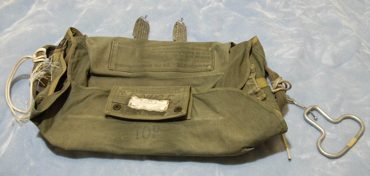 The canvas bag that held one of the parachutes given to D.B. Cooper in 1971. Cooper requested four chutes, used two (including one sewn shut for instruction), and used the cord from a third parachute to tie the stolen money bag.