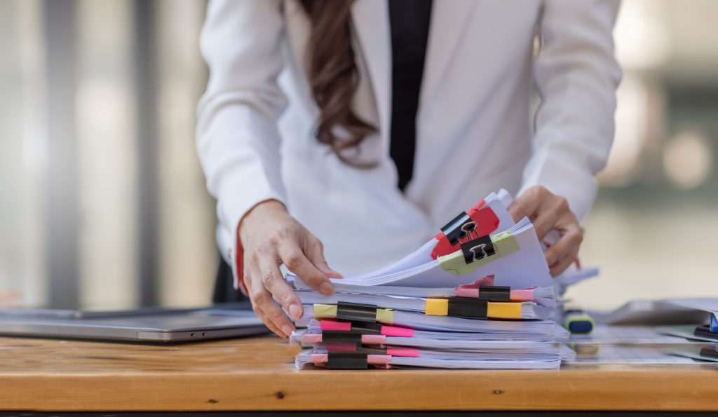 business accountant document legal, auditor businesswoman office employee working with documents at the table workplace, closeup