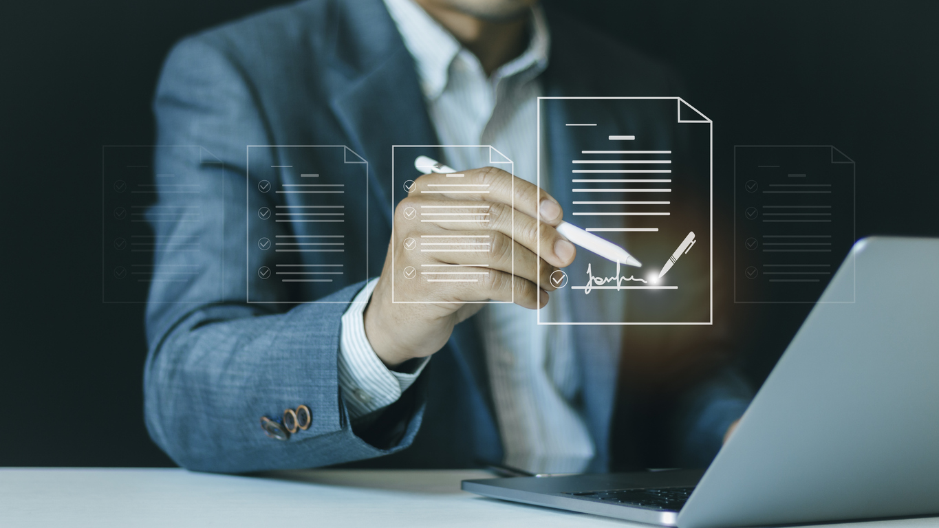 paperless workplace, e signing concept, businessman signs document on a digital document on a virtual notebook screen using a stylus pen. electronic signature, document management.