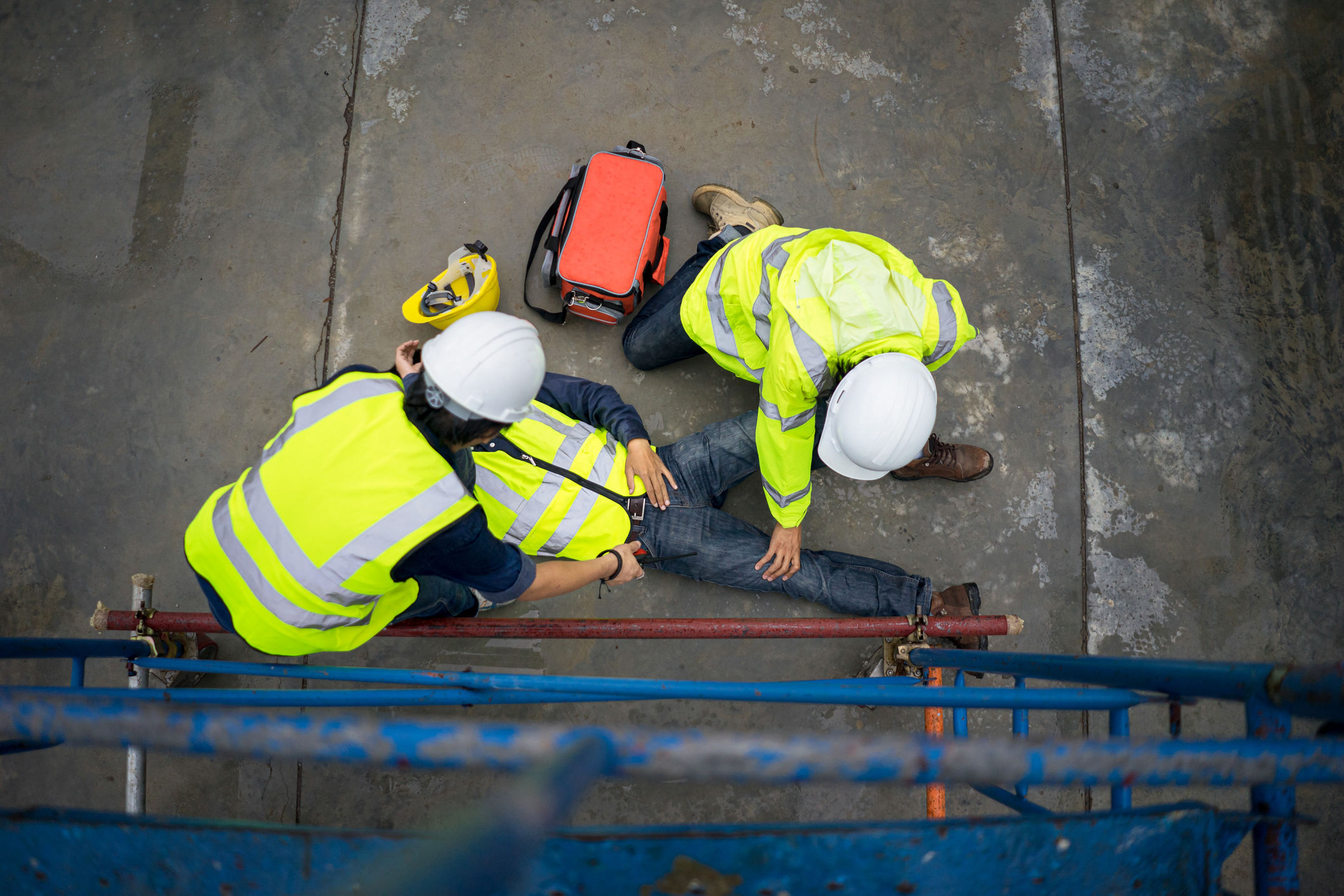 safety team help employee accident falling scaffolding to the floor.