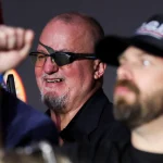 Oath Keepers Founder Stewart Rhodes Appears at Trump’s Las Vegas Rally After Prison Release