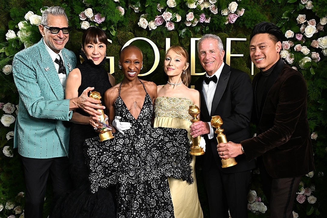 Jeff Goldblum, Michelle Yeoh, Cynthia Erivo, Ariana Grande, Marc Platt and Jon M. Chu receive the Cinematic and Box Office Achievement award for “Wicked” at the 82nd Annual Golden Globe Awards at The Beverly Hilton in Beverly Hills, California. l January 5, 2025