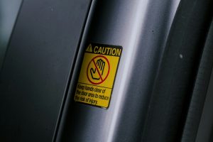 a caution sign on the side of a vehicle