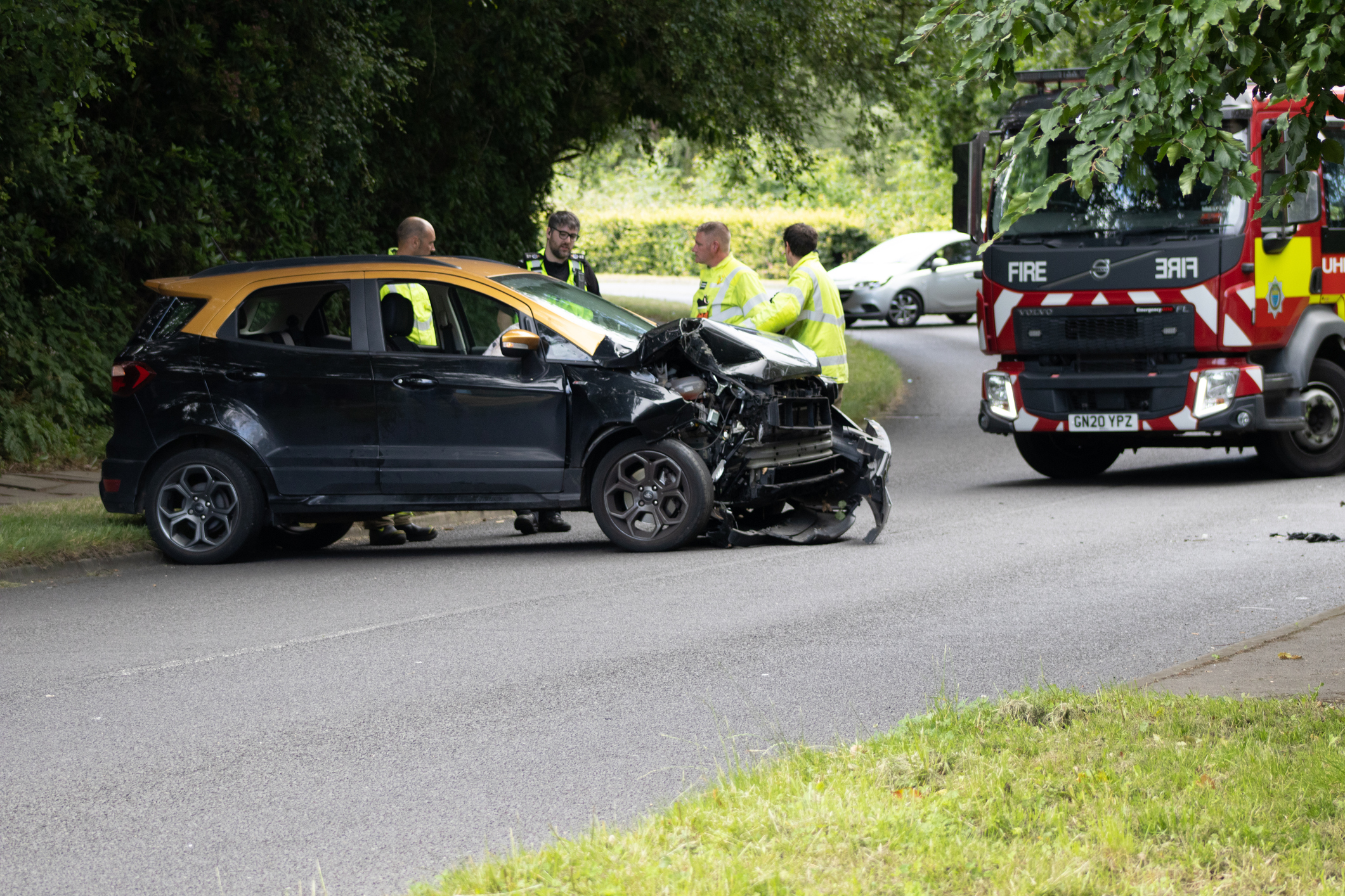 car crash with fire engine in background