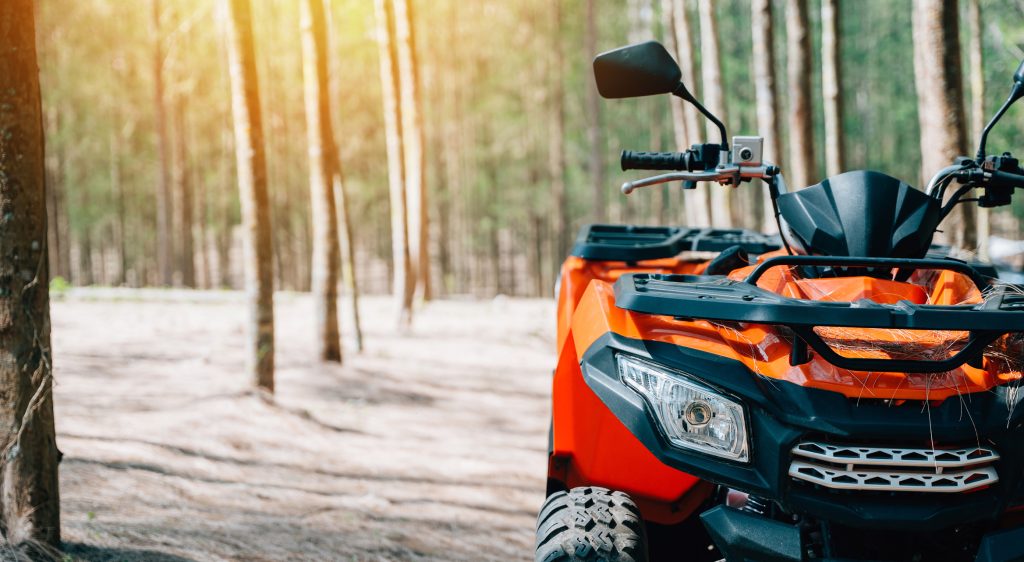 an atv adventure through the forest at sunset, with nobody around