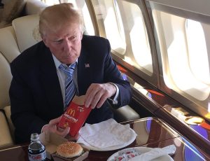 Trump eating McDonald's on a jet